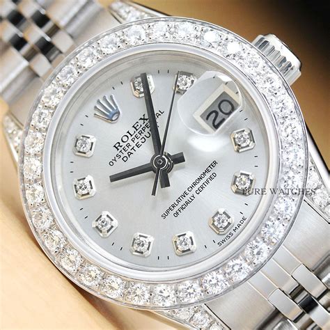 ladies rolex with diamond bezel.